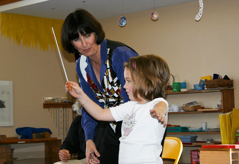 Maestra Harrigan visiting a school